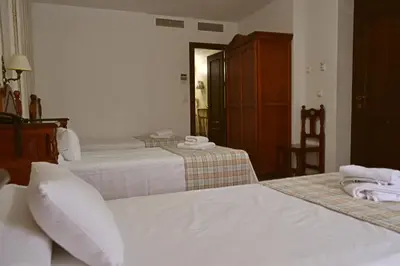 Cama o camas de una habitación en Hotel Marisa