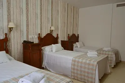Cama o camas de una habitación en Hotel Marisa