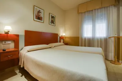 Cama o camas de una habitación en Hostal Forum