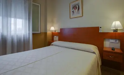 Cama o camas de una habitación en Hostal Forum