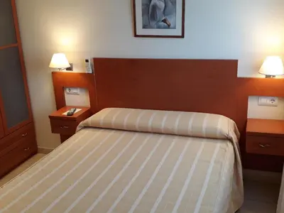 Cama o camas de una habitación en Hostal Forum