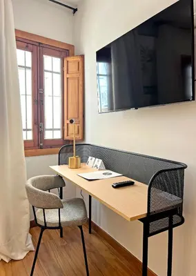 Una televisión o centro de entretenimiento en Soho Boutique Hospedería del Atalia