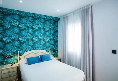 Cama o camas de una habitación en Hostal San Francisco
