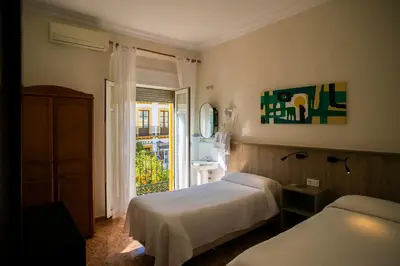 Cama o camas de una habitación en Pensión Dulces Sueños