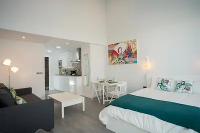 Cama o camas de una habitación en Algo Diferente Apartamentos
