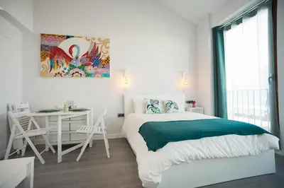 Cama o camas de una habitación en Algo Diferente Apartamentos