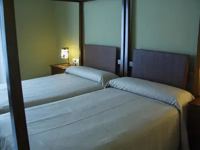 Cama o camas de una habitación en Hotel Las Casas del Duque