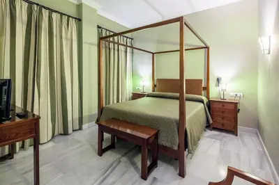 Cama o camas de una habitación en Hotel Las Casas del Duque