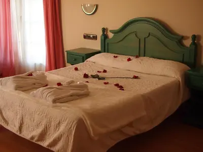 Cama o camas de una habitación en Hotel Mitra Crisálida