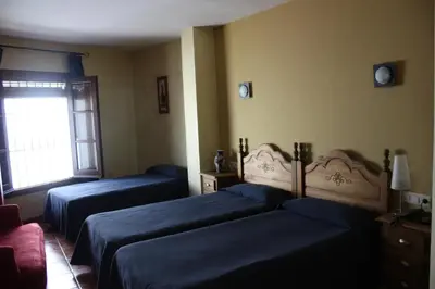 Cama o camas de una habitación en Hotel Don Pero