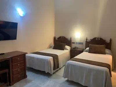 Cama o camas de una habitación en Hotel Casa Museo de la Mezquita