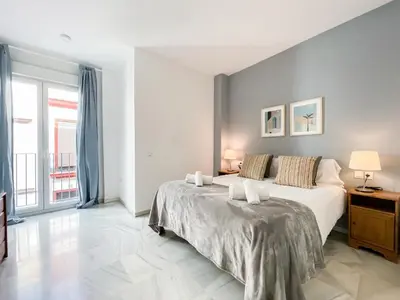 Cama o camas de una habitación en San Marcos Apartamentos