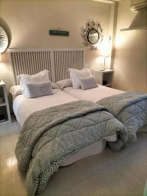 Cama o camas de una habitación en Apartamentos Flamenco B&B