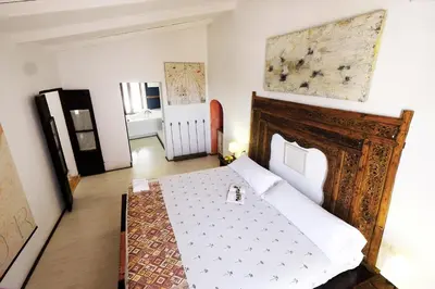 Cama o camas de una habitación en La Casa de la Luz. ArtistHome