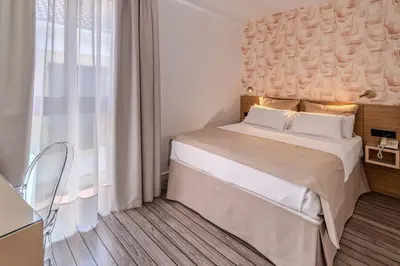Cama o camas de una habitación en La Boutique Puerta Osario