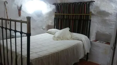 Cama o camas de una habitación en Cueva Rural La Noguera