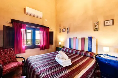 Cama o camas de una habitación en Casa Rural Sierra Jayona