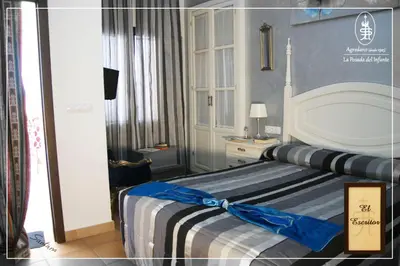 Cama o camas de una habitación en La Posada Del Infante