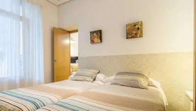 Cama o camas de una habitación en La Casa del Conde de Gelves Apartments