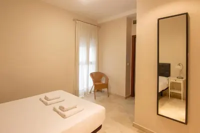Cama o camas de una habitación en RentalSevilla Cano y Cueto II