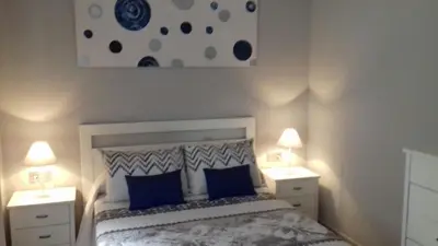 Cama o camas de una habitación en Pompeyos Viviendas Vacacionales