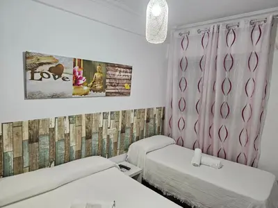 Cama o camas de una habitación en Pension Hidalgo 1