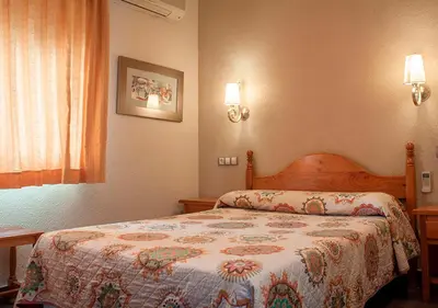 Cama o camas de una habitación en Hotel La Zambra