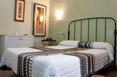 Cama o camas de una habitación en Hotel La Zambra