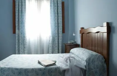 Cama o camas de una habitación en Hotel Rural Miguel Angel