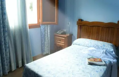 Cama o camas de una habitación en Hotel Rural Miguel Angel