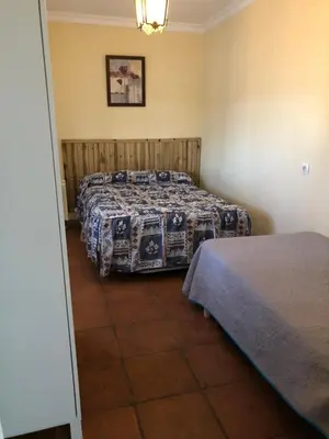 Cama o camas de una habitación en Casa rural en Constantina