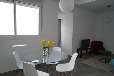 Zona de estar de Atico con terraza en Alameda de Hercules