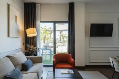 Una televisión o centro de entretenimiento en Sevilla Green Suites