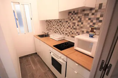 Una cocina o zona de cocina en the apatment/el apartamento City centre