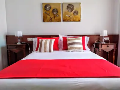 Cama o camas de una habitación en Hostal La Laguna