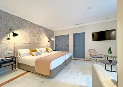 Cama o camas de una habitación en Itaca Sevilla by Soho Boutique