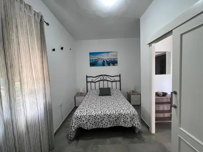 Cama o camas de una habitación en Chalet piscina jakuzzi sevilla