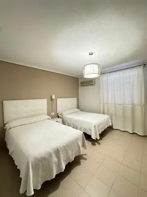 Cama o camas de una habitación en Hotel Castillo de Montemayor
