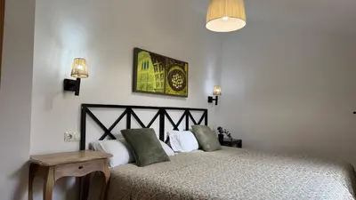 Cama o camas de una habitación en Apartamentos Alcazar de Baeza
