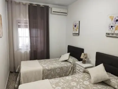 Cama o camas de una habitación en Acogedora casa cerca de Córdoba