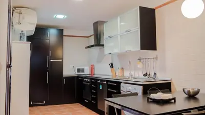 Una cocina o zona de cocina en Apartamento El Salón