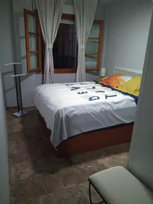 Cama o camas de una habitación en casa de los patios amurallados