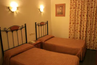 Cama o camas de una habitación en Hostal San Andres