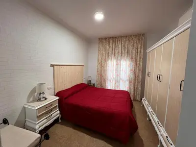 Cama o camas de una habitación en Apartamentos Virgen de Villaverde