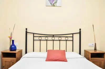 Cama o camas de una habitación en Pensión La Montoreña