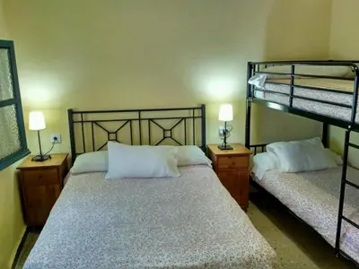 Cama o camas de una habitación en Pensión La Montoreña