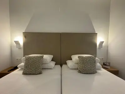 Cama o camas de una habitación en Hotel RL Anibal