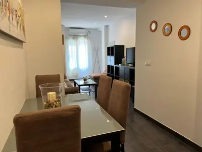 Una televisión o centro de entretenimiento en Apartamento Puente Romano
