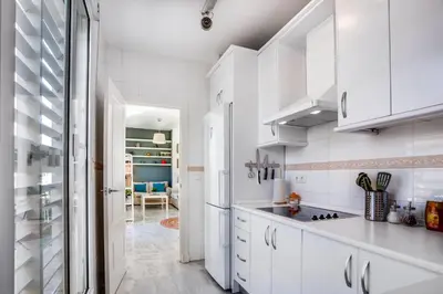 Una cocina o zona de cocina en Encantador Ático con Terraza