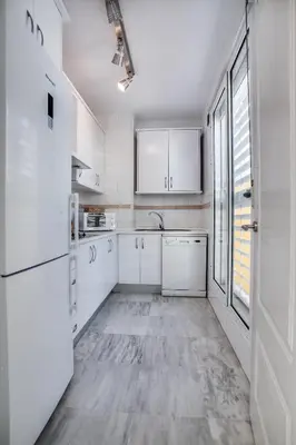 Una cocina o zona de cocina en Encantador Ático con Terraza
